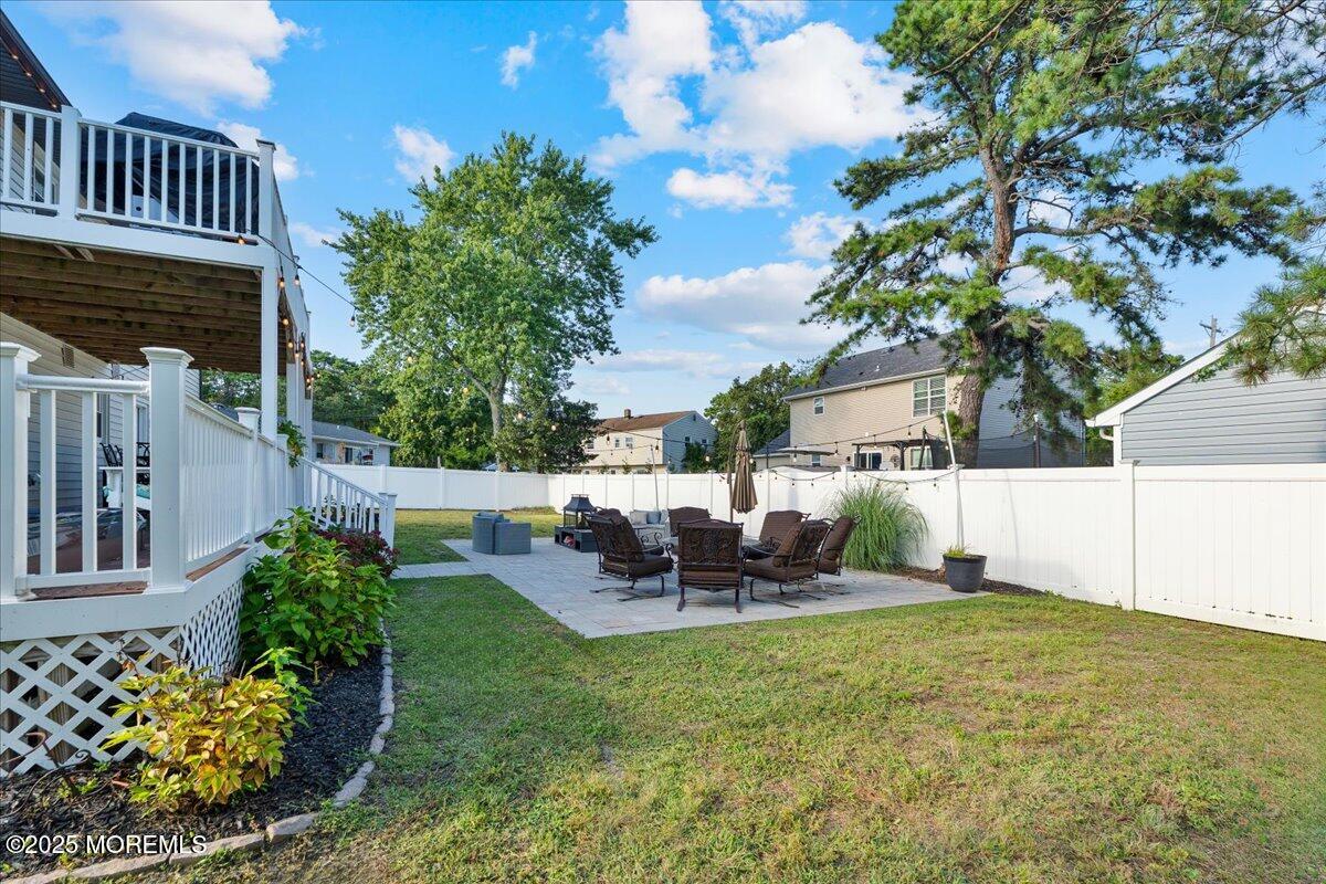 165 Port Road Brick, NJ 08723 - Photo 42 of 48 a view of a chair and table in the backyard