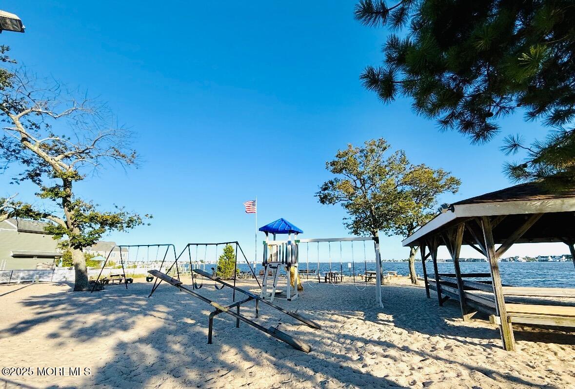 165 Port Road Brick, NJ 08723 - Photo 46 of 48 a view of a swimming pool with a patio