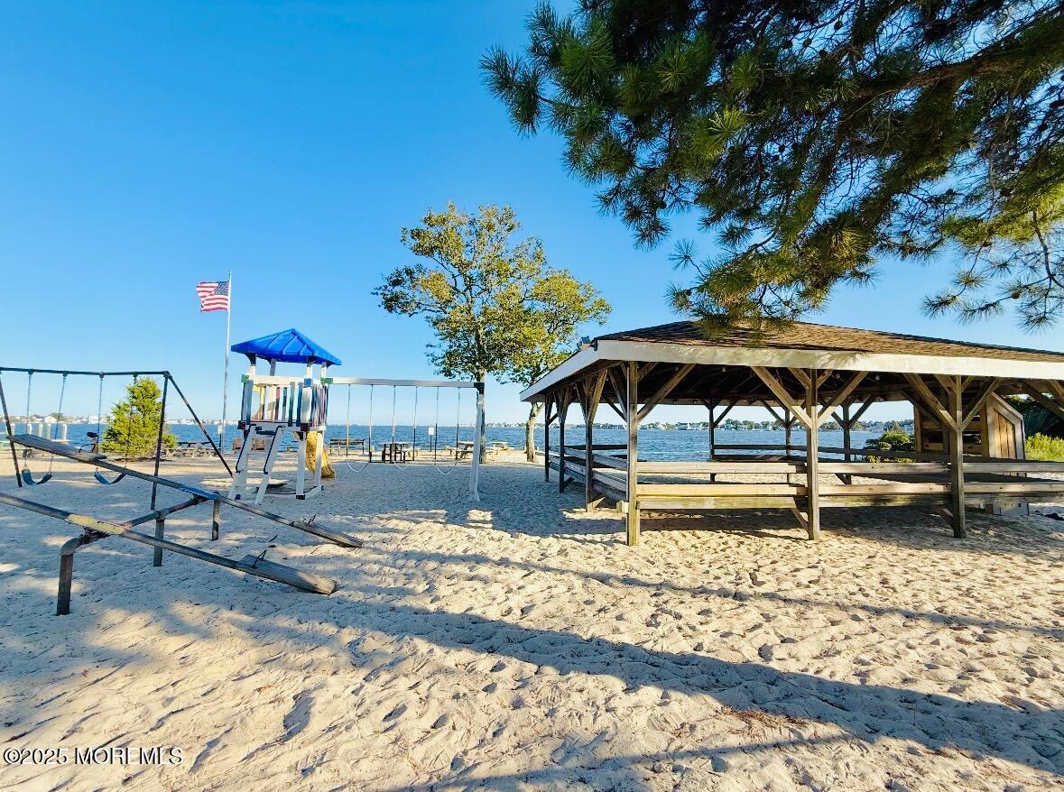 165 Port Road Brick, NJ 08723 - Photo 48 of 48 a front view of a house with garden
