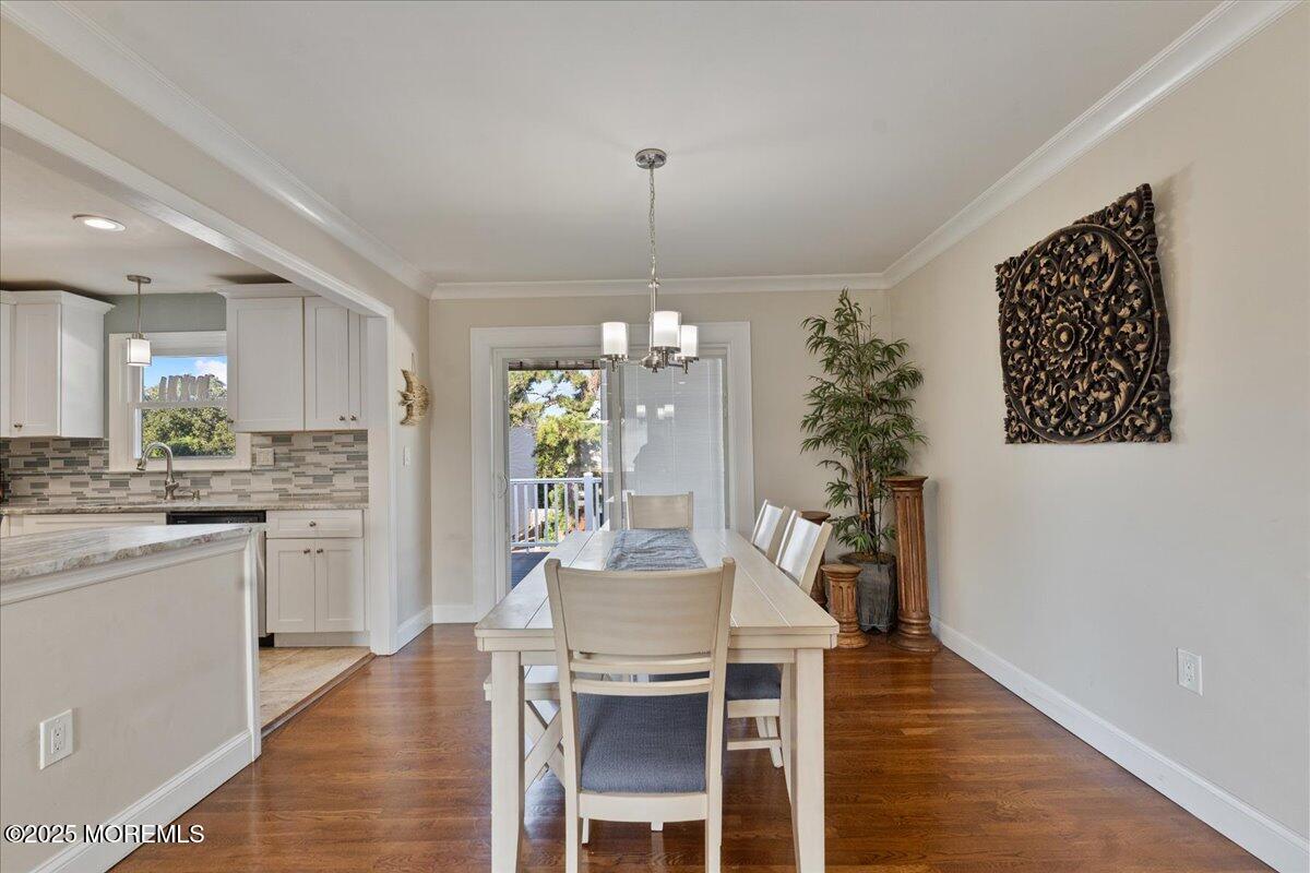 165 Port Road Brick, NJ 08723 - Photo 9 of 48 a kitchen with furniture and a chandelier