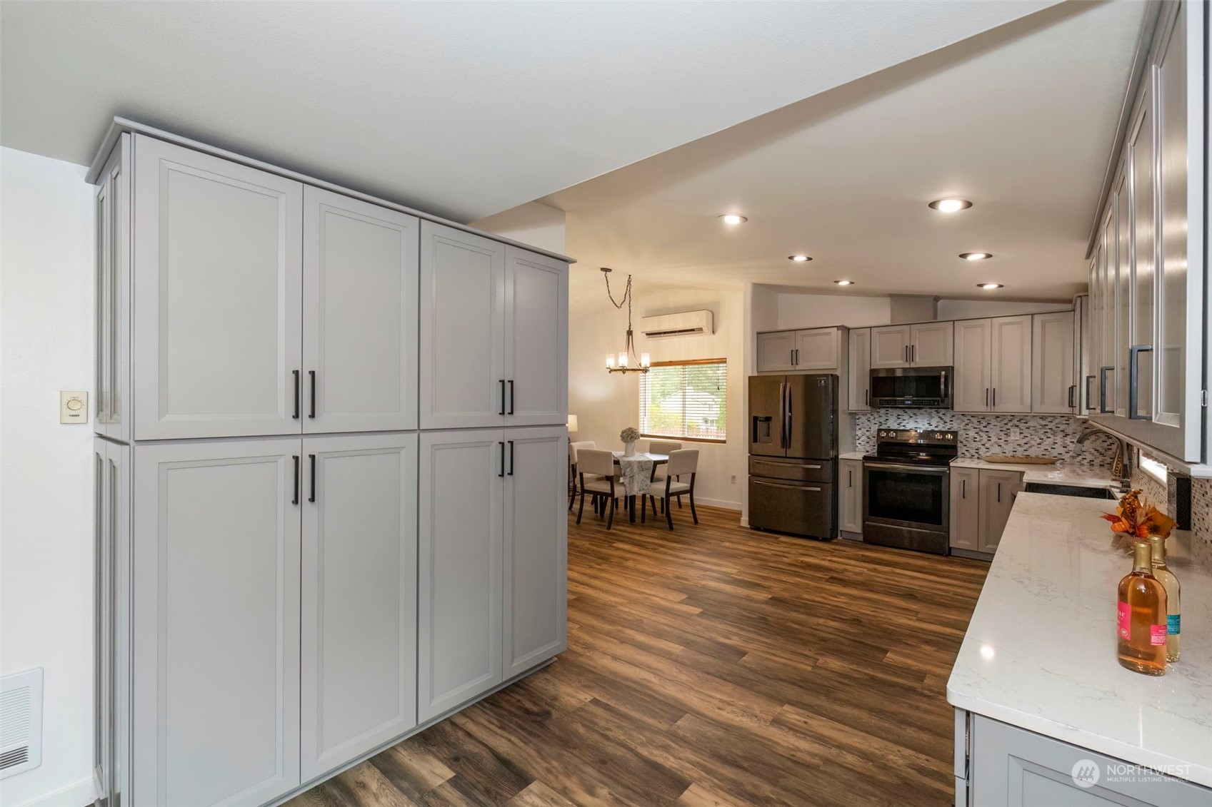 27474 Gamble Bay Road Northeast Kingston, WA 98346 - Photo 15 of 40 a kitchen with stainless steel appliances a refrigerator and a stove top oven