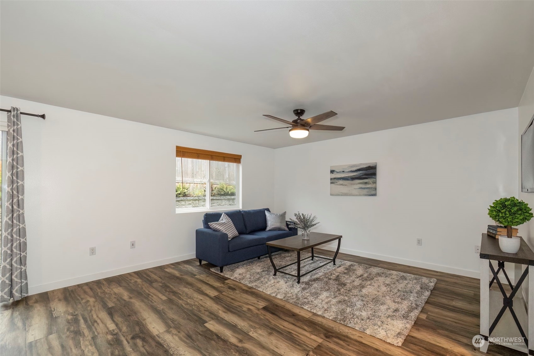27474 Gamble Bay Road Northeast Kingston, WA 98346 - Photo 16 of 40 a living room with furniture and a window