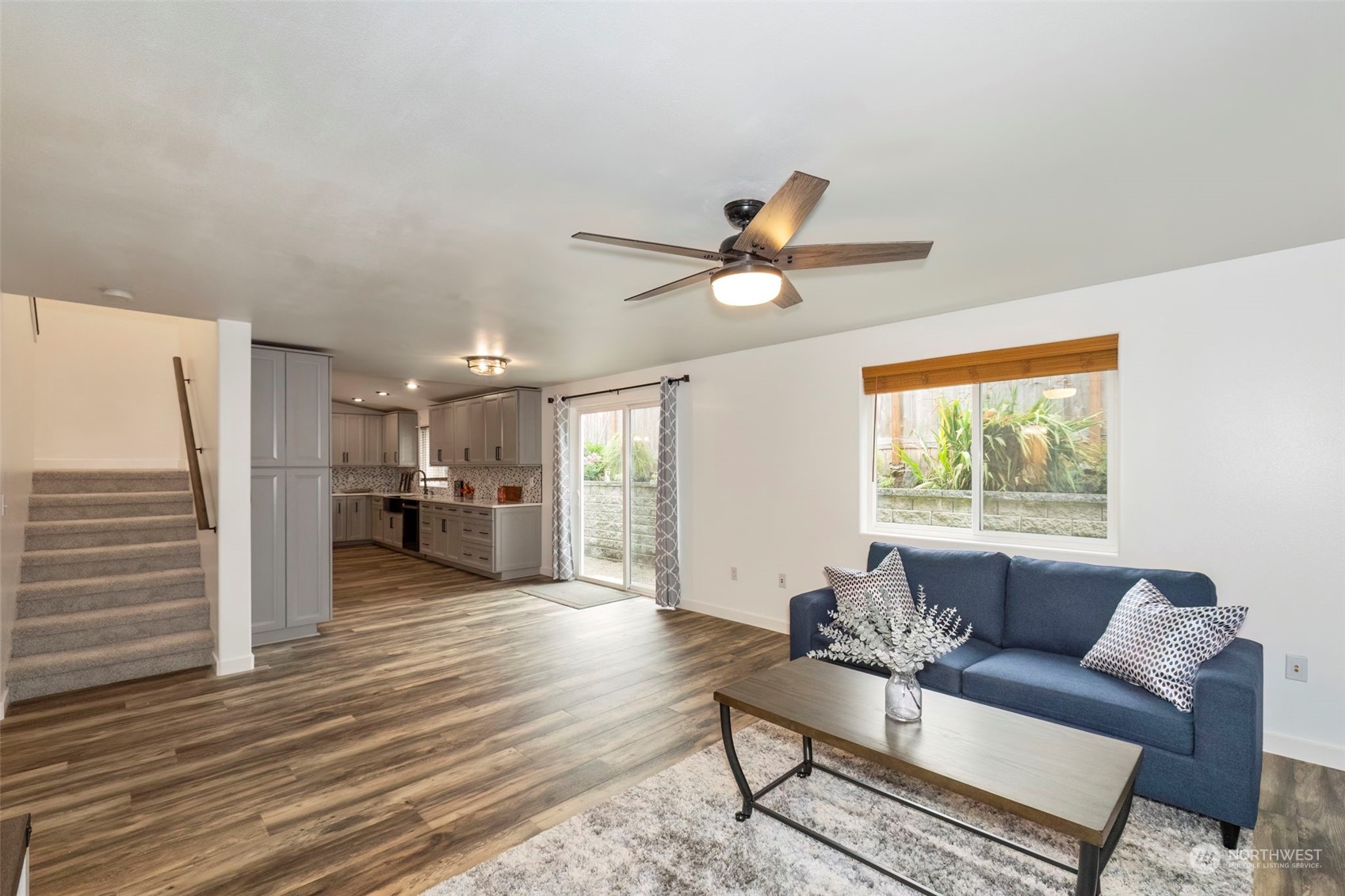 27474 Gamble Bay Road Northeast Kingston, WA 98346 - Photo 17 of 40 a living room with furniture and a large window