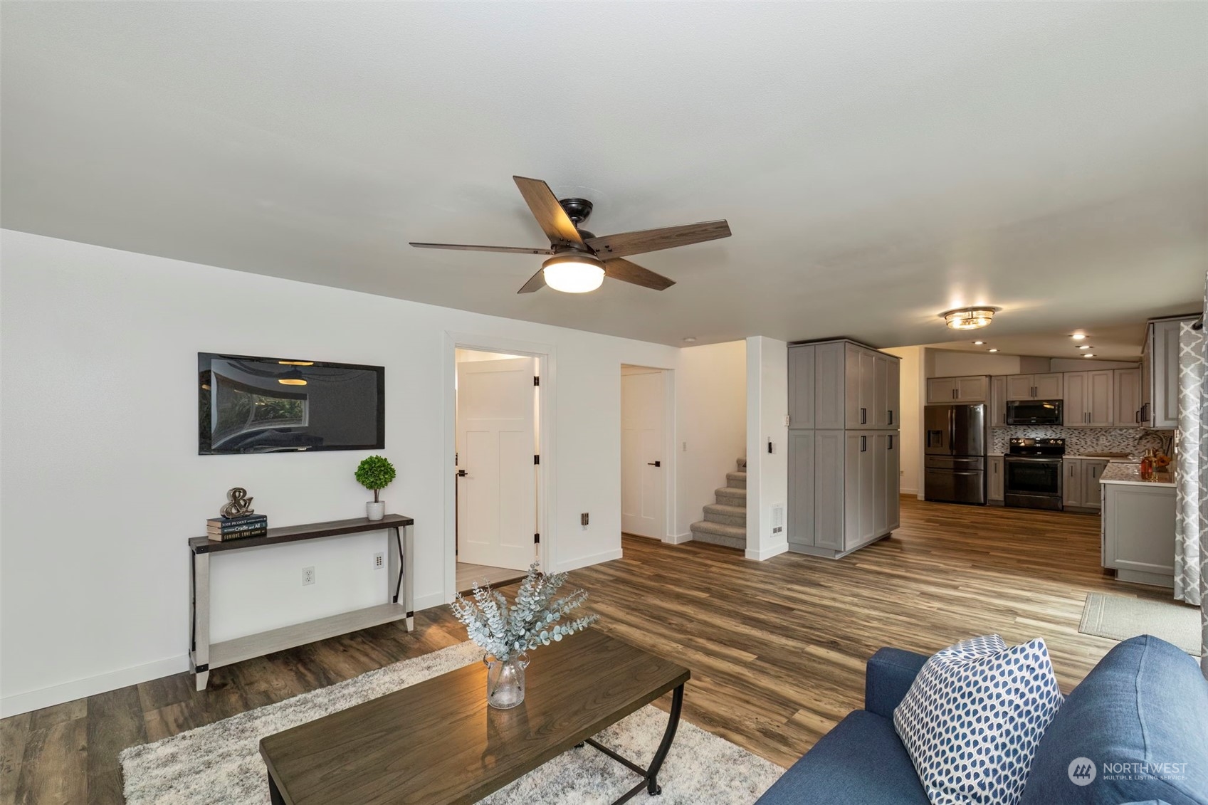 27474 Gamble Bay Road Northeast Kingston, WA 98346 - Photo 18 of 40 a living room with furniture and a ceiling fan