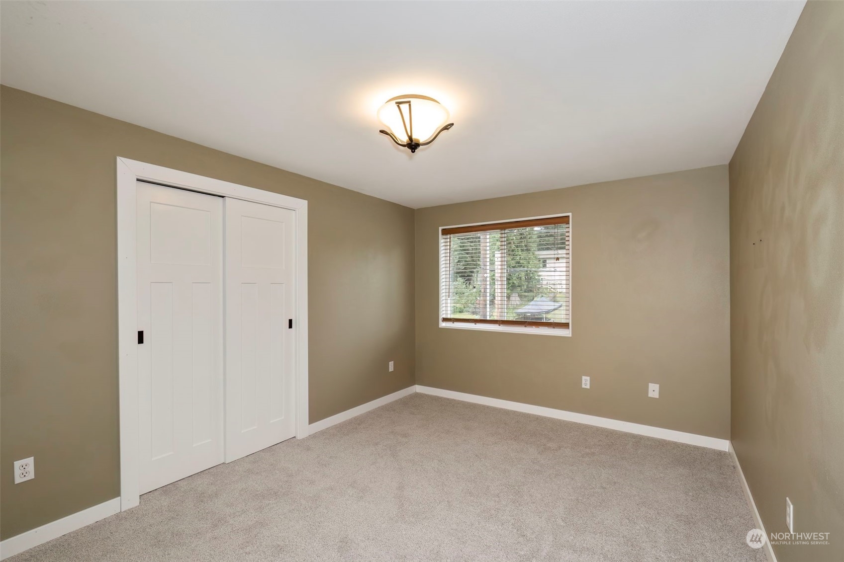 27474 Gamble Bay Road Northeast Kingston, WA 98346 - Photo 21 of 40 a view of an empty room with a window