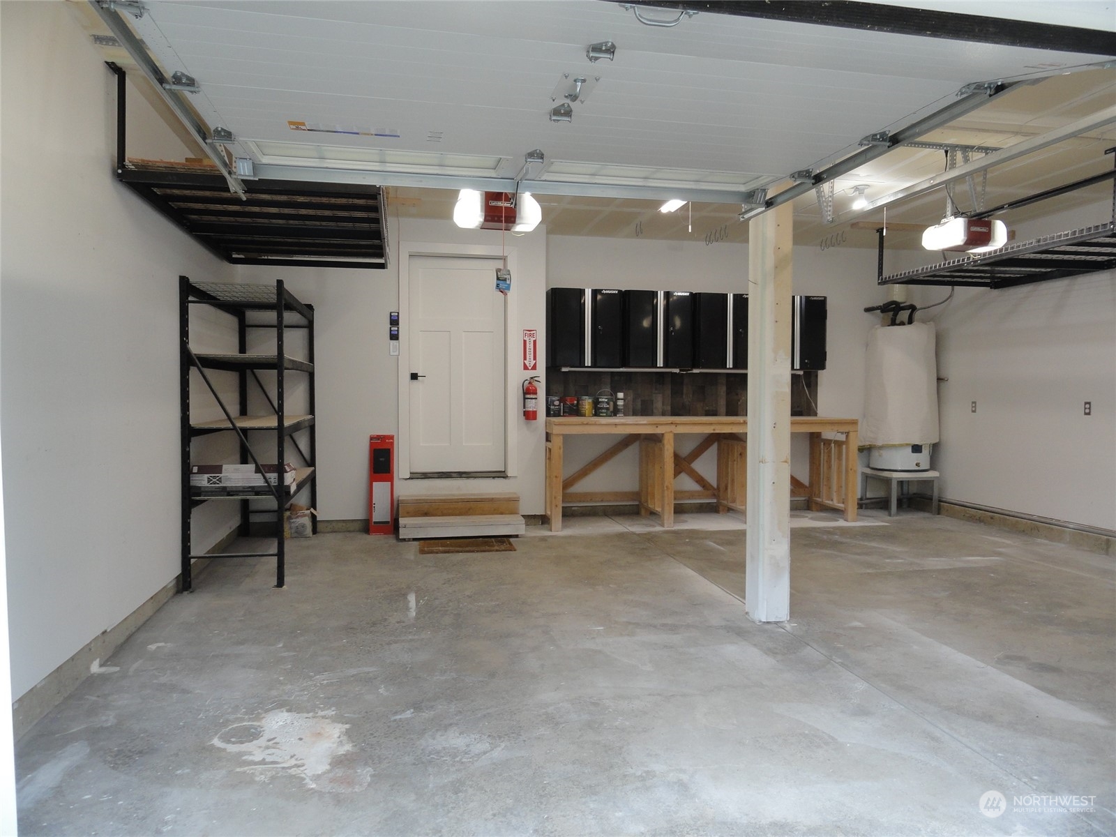 27474 Gamble Bay Road Northeast Kingston, WA 98346 - Photo 29 of 40 a view of a livingroom with furniture and a garage