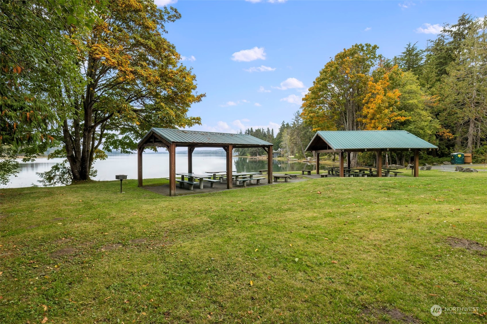 27474 Gamble Bay Road Northeast Kingston, WA 98346 - Photo 37 of 40 a view of a table and chairs in the garden