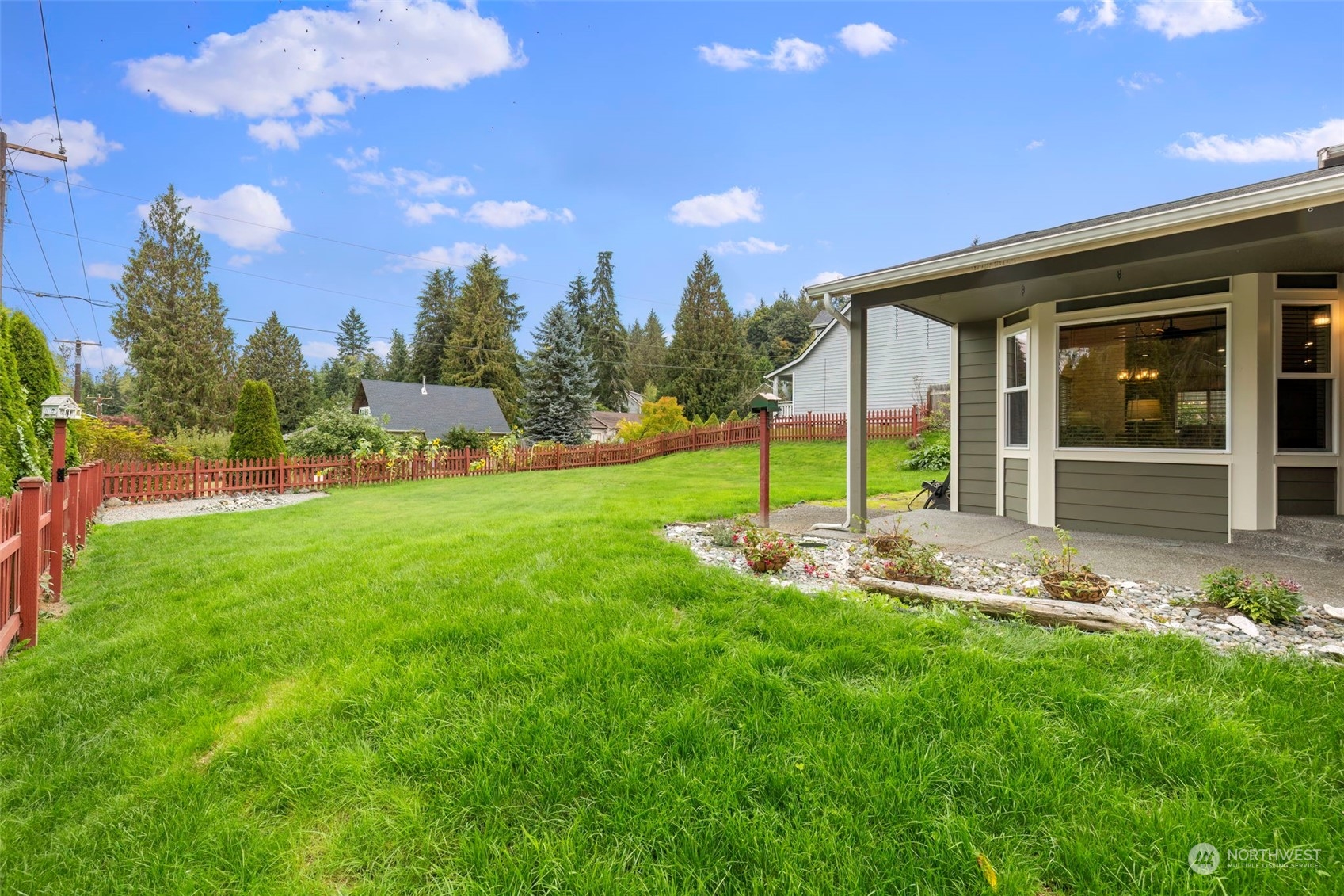 27474 Gamble Bay Road Northeast Kingston, WA 98346 - Photo 4 of 40 a view of a house with backyard and porch