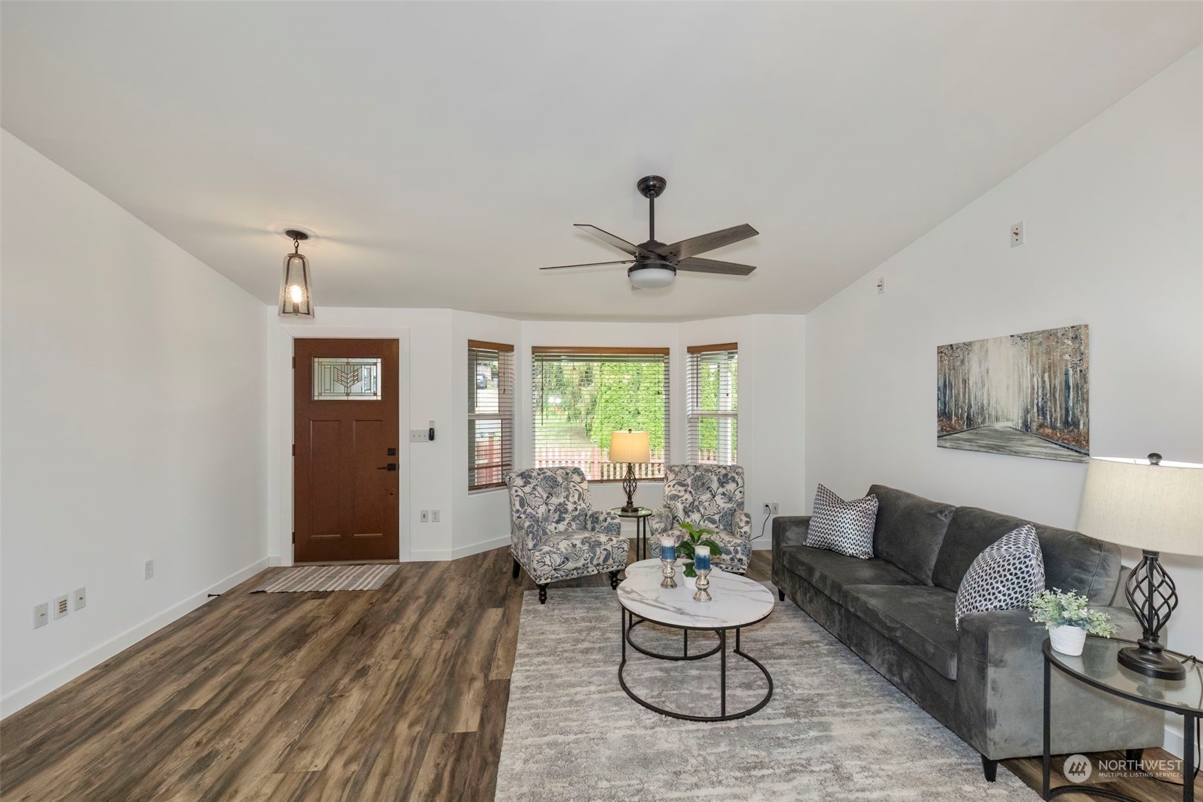 27474 Gamble Bay Road Northeast Kingston, WA 98346 - Photo 5 of 40 a living room with furniture and a large window