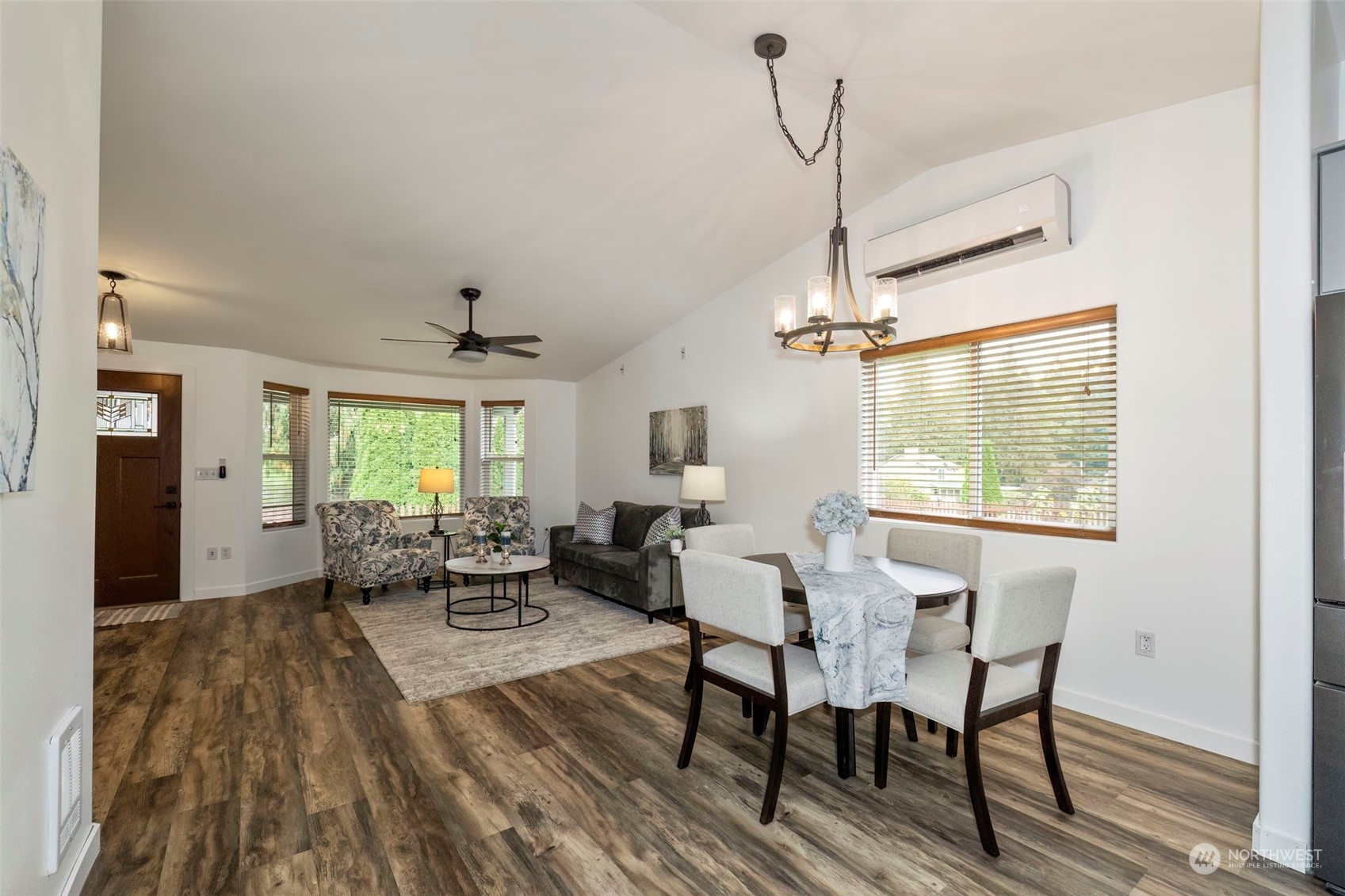 27474 Gamble Bay Road Northeast Kingston, WA 98346 - Photo 8 of 40 a view of a dining room with furniture window and wooden floor