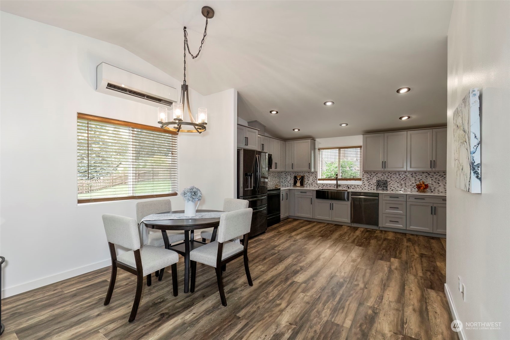 27474 Gamble Bay Road Northeast Kingston, WA 98346 - Photo 9 of 40 a kitchen with a table and chairs in it