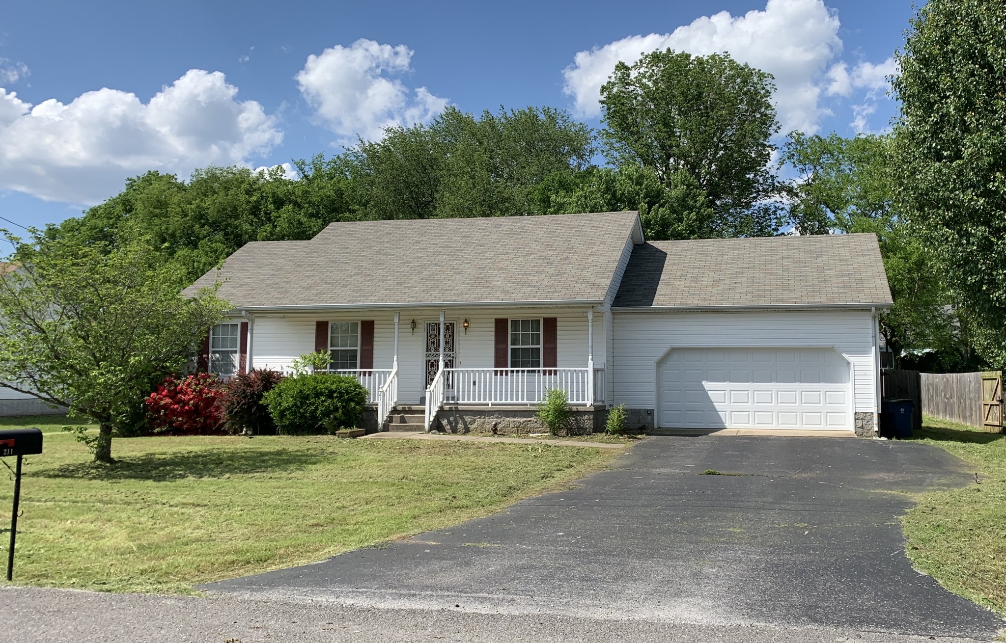 211 Shrewsbury Road Murfreesboro, TN 37129 - Photo 1 of 2 a front view of a house with a yard and garage
