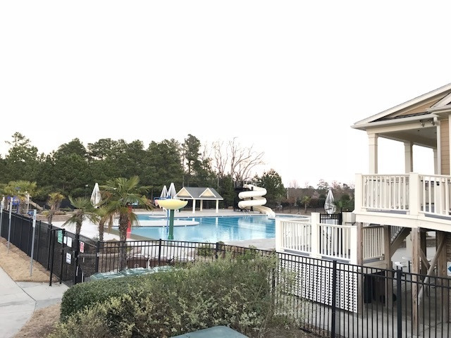 517 Front Ridge Drive Cary, NC 27519 - Photo 22 of 25 with Kiddie Splash Area and Fun Slide. Twin Lakes clubhouse with Kitchen available to rent for functions. Tot Lot and Swings. Amazing Twin Lakes Pool