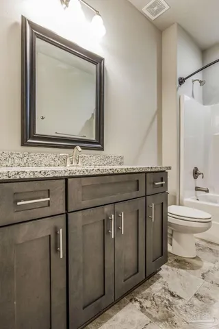 a view of a kitchen with dining room wooden floor and windows