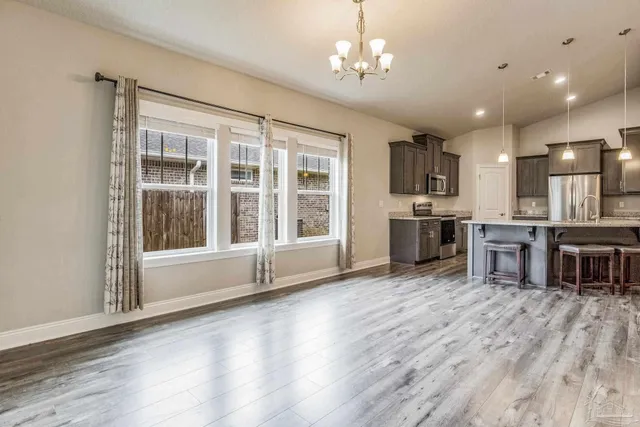 a kitchen with a refrigerator a sink and a stove