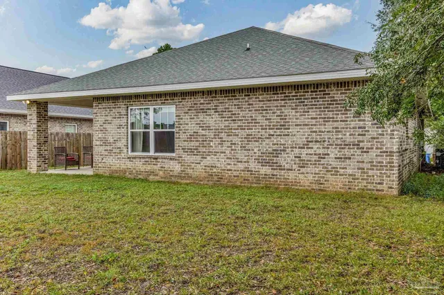 a front view of house with garden