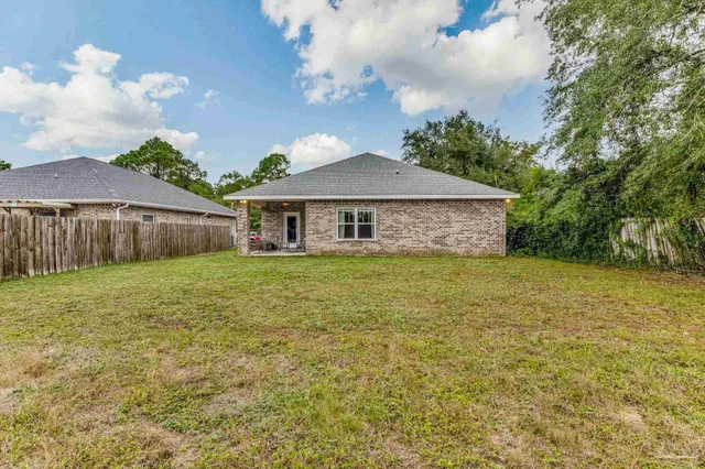 a backyard of a house with lots of green space