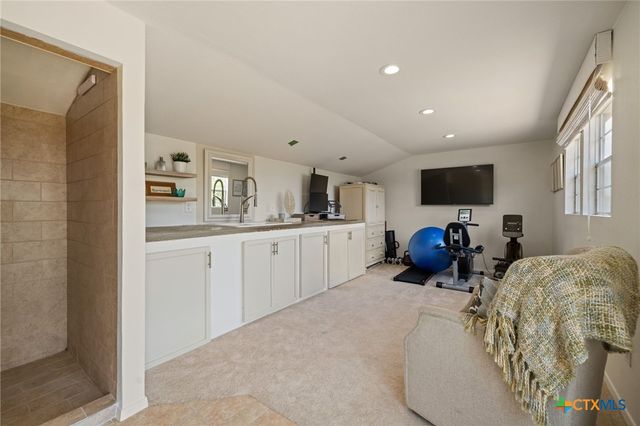 a living room with furniture and a window