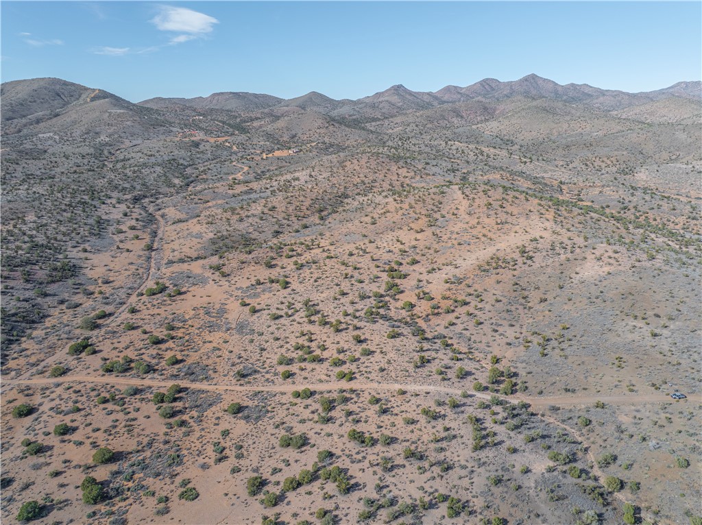 View of mountain background featuring a desert landscape and rural landscape