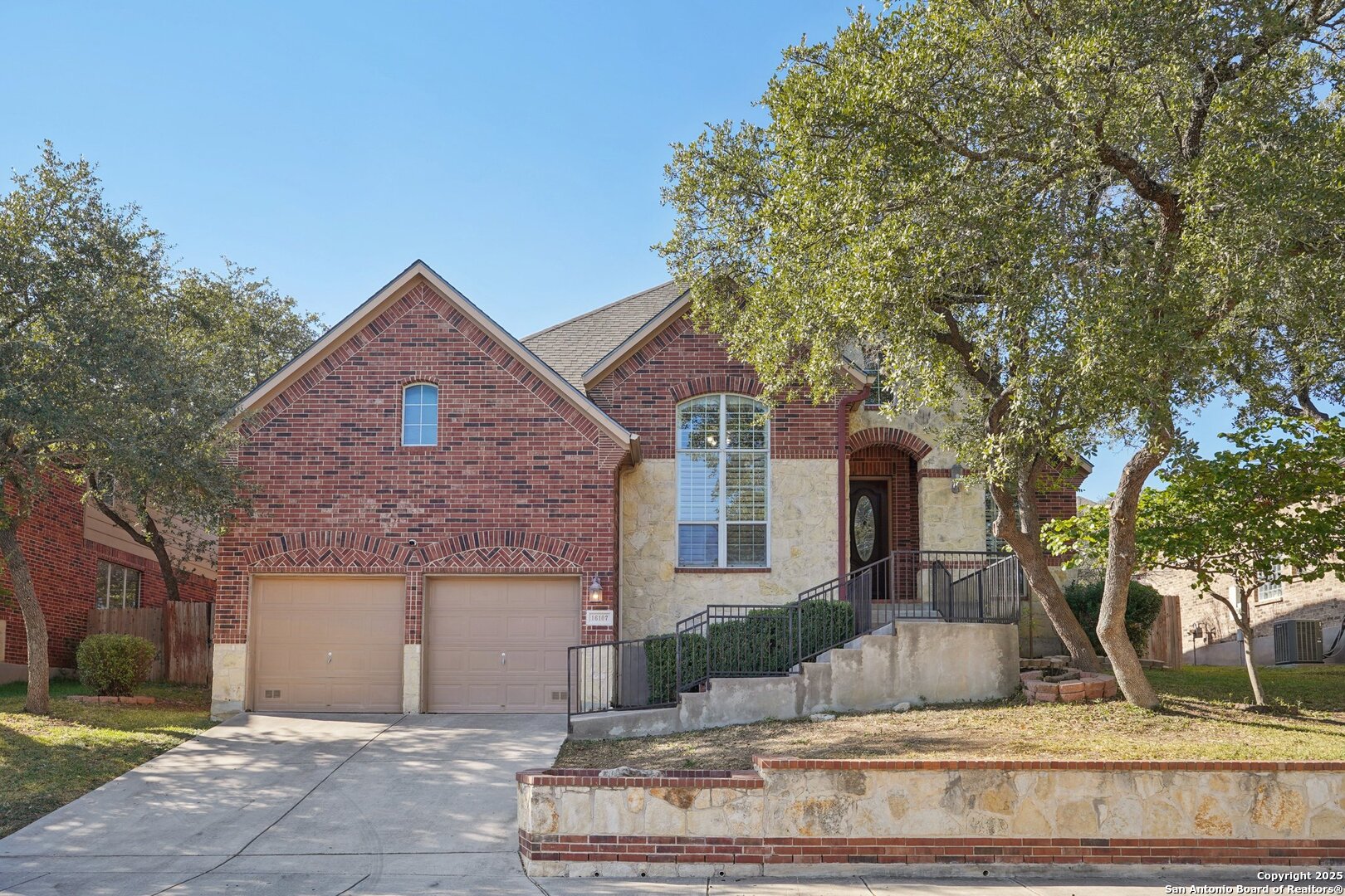 16107 Los Sedona Helotes, TX 78023 - Photo 1 of 59 a front view of a house with a yard