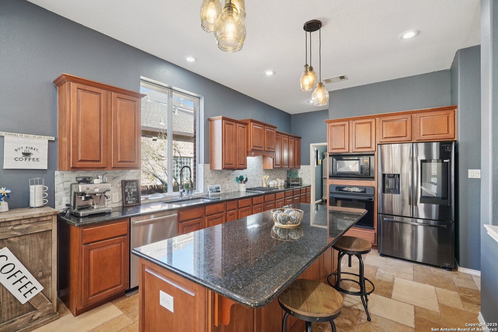 16107 Los Sedona Helotes, TX 78023 - Photo 15 of 59 a kitchen with stainless steel appliances granite countertop a sink refrigerator and cabinets