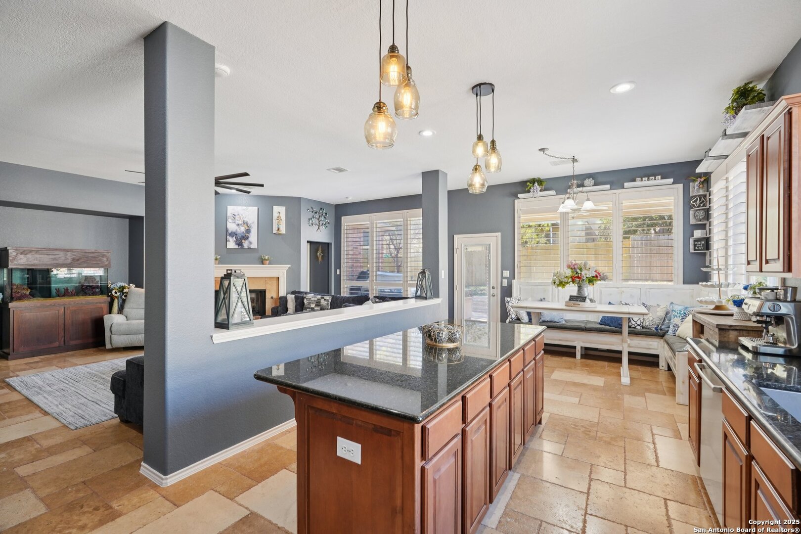 16107 Los Sedona Helotes, TX 78023 - Photo 17 of 59 a dining hall with stainless steel appliances kitchen island granite countertop a table and chairs