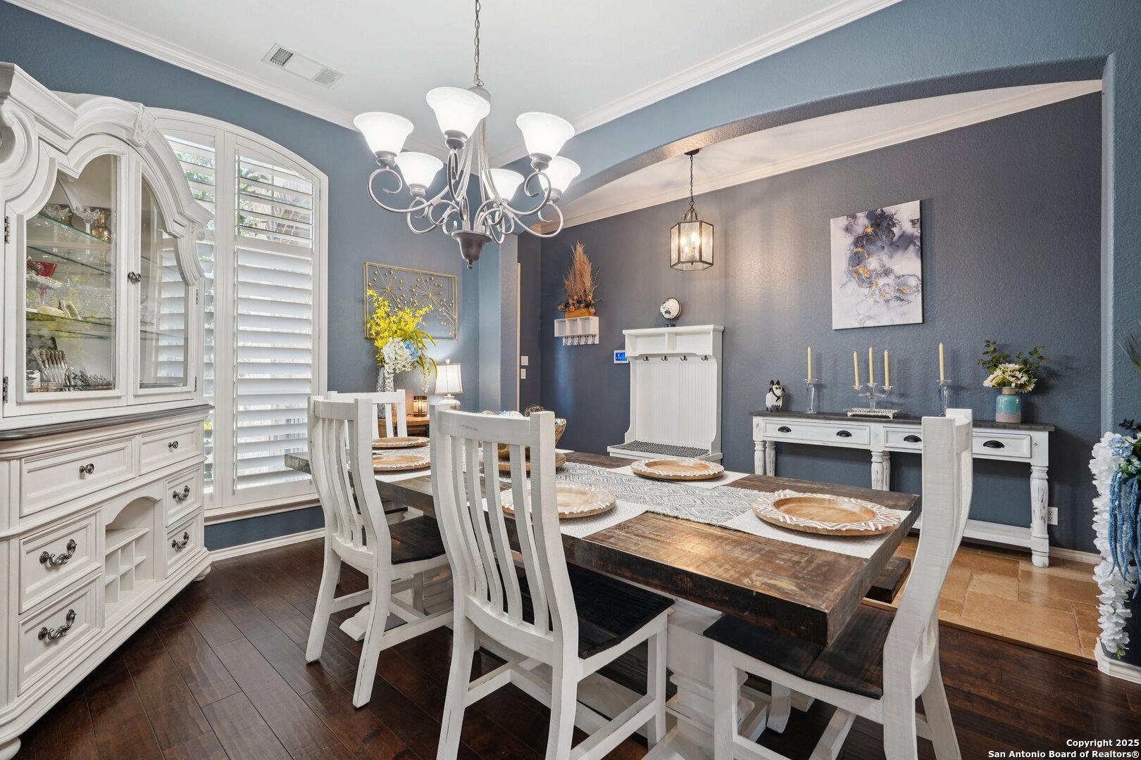 16107 Los Sedona Helotes, TX 78023 - Photo 19 of 59 a view of a dining room with furniture a chandelier and wooden floor