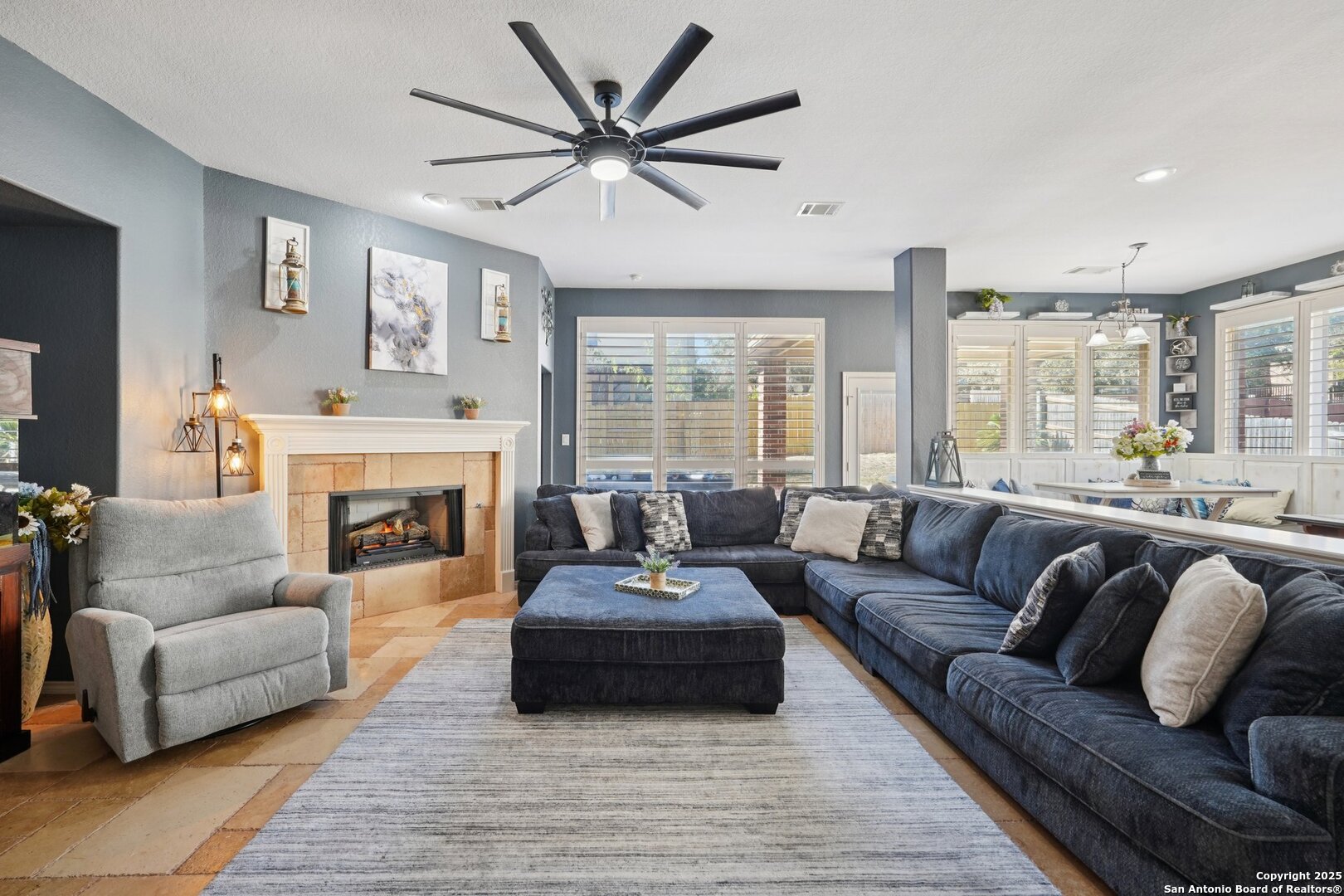 16107 Los Sedona Helotes, TX 78023 - Photo 21 of 59 a living room with furniture and a fireplace