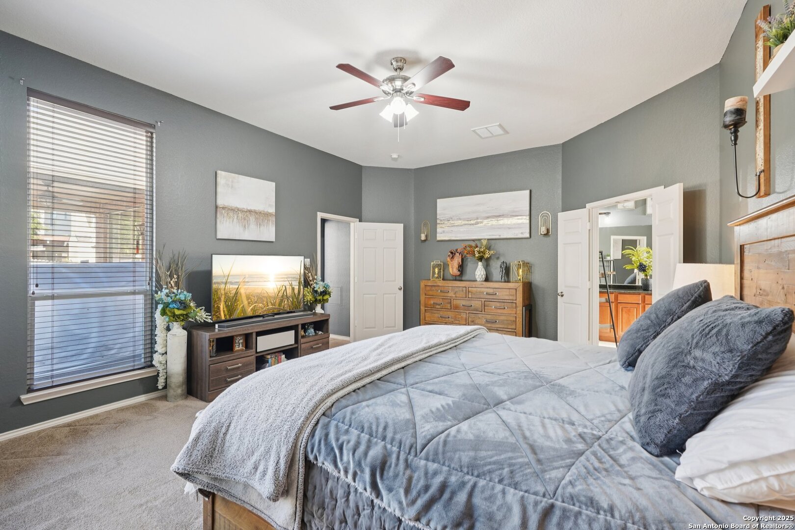 16107 Los Sedona Helotes, TX 78023 - Photo 25 of 59 a bedroom with a bed and a table in it