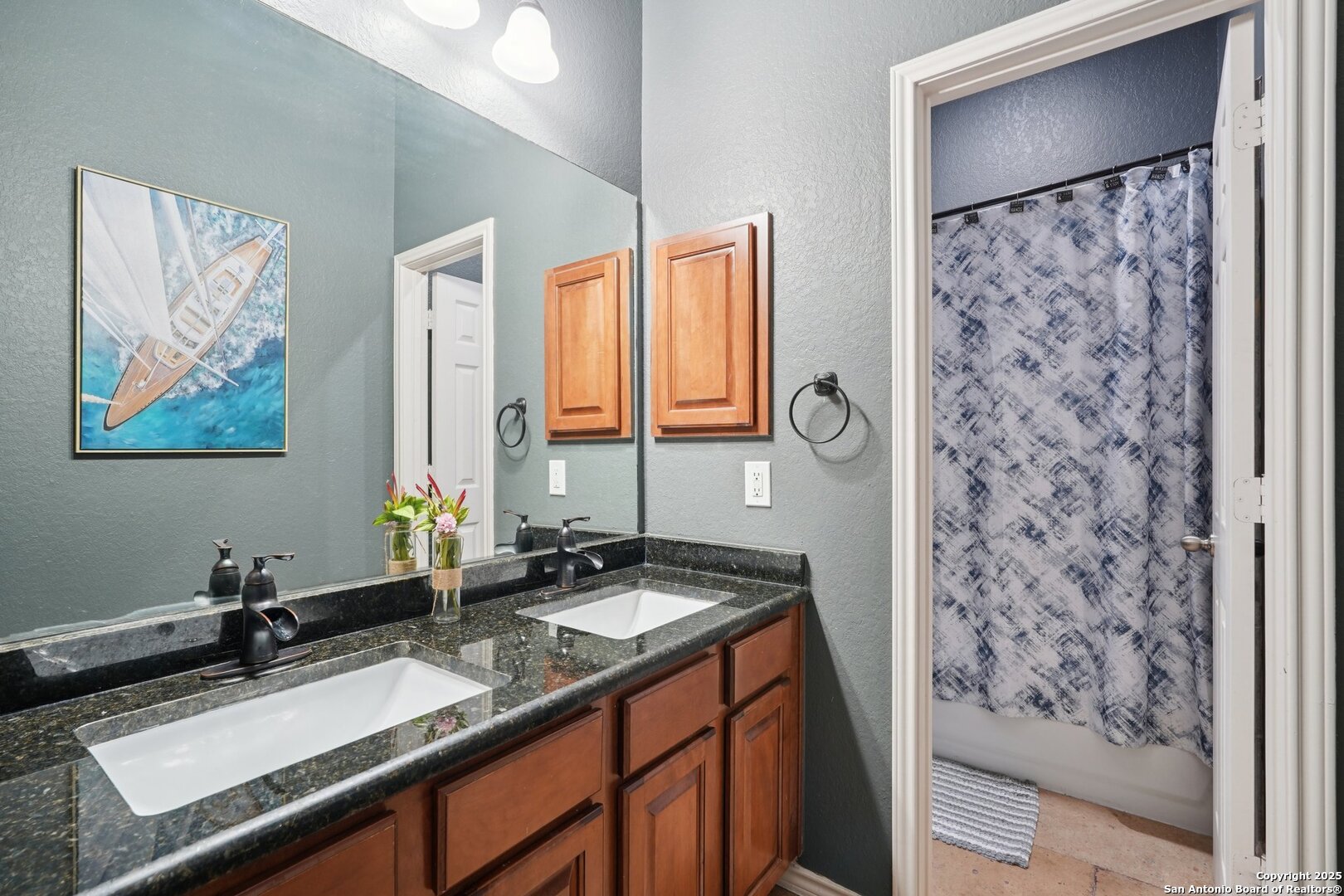 16107 Los Sedona Helotes, TX 78023 - Photo 35 of 59 a bathroom with a granite countertop sink a mirror a and a window