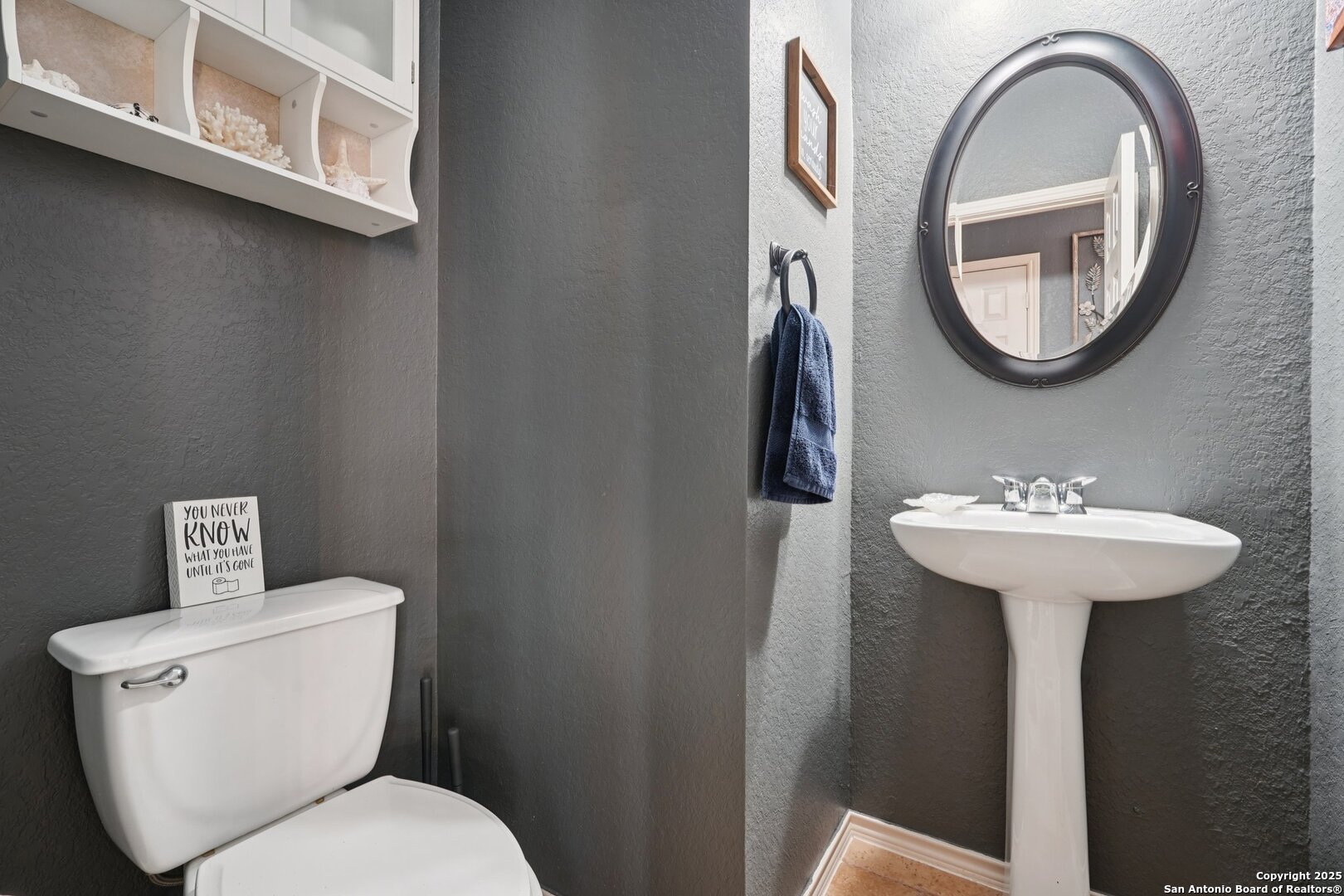 16107 Los Sedona Helotes, TX 78023 - Photo 41 of 59 a bathroom with a toilet sink and mirror