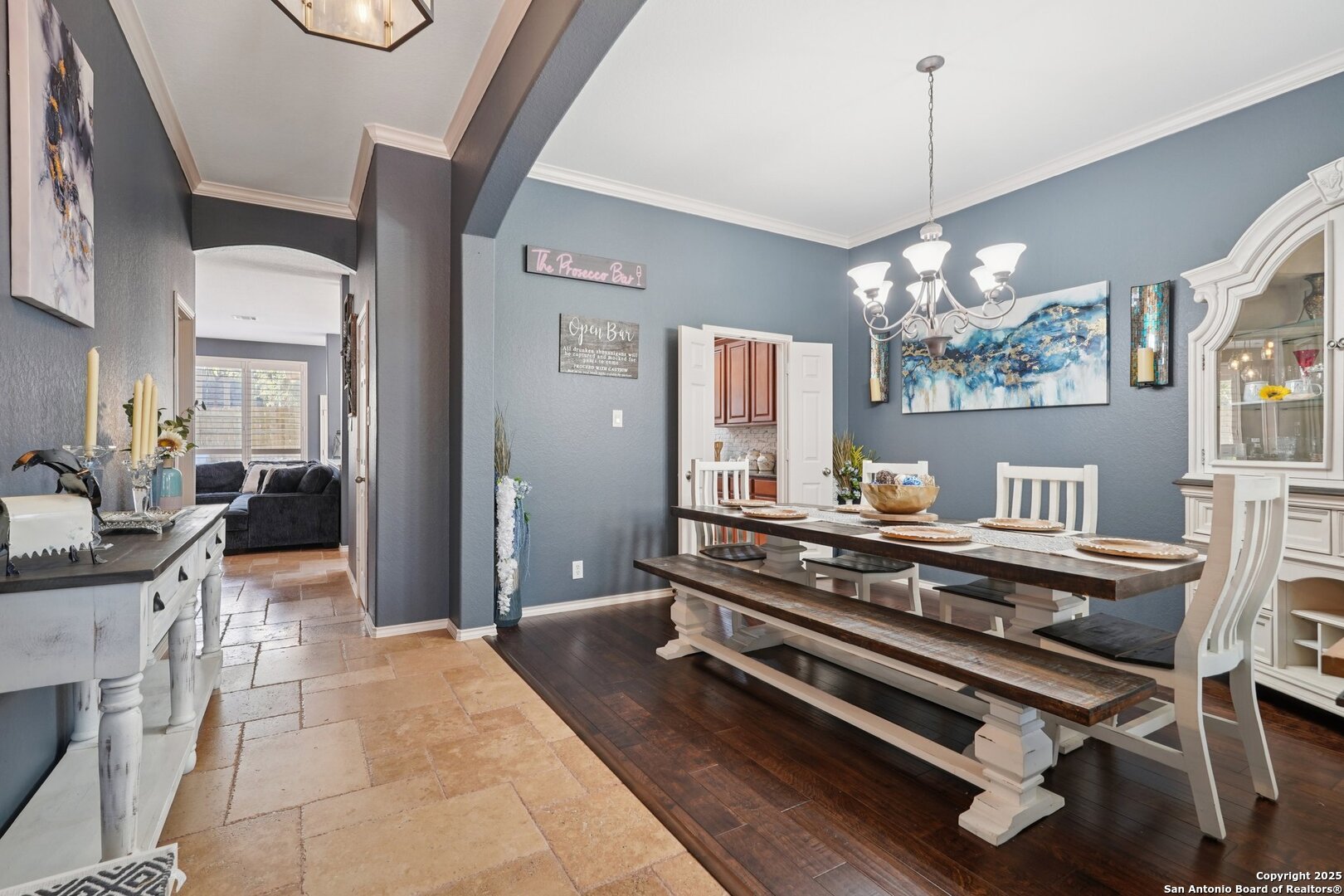 16107 Los Sedona Helotes, TX 78023 - Photo 6 of 59 a view of a dining room with furniture a chandelier and wooden floor