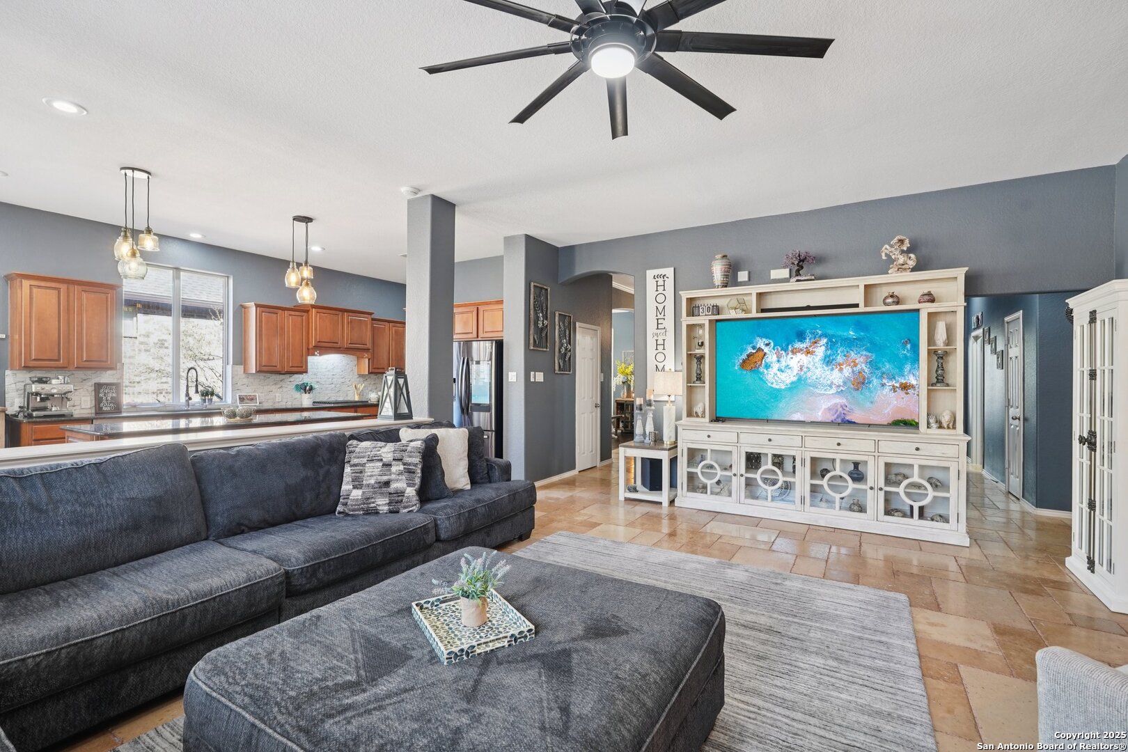 16107 Los Sedona Helotes, TX 78023 - Photo 9 of 59 a living room with furniture and a flat screen tv