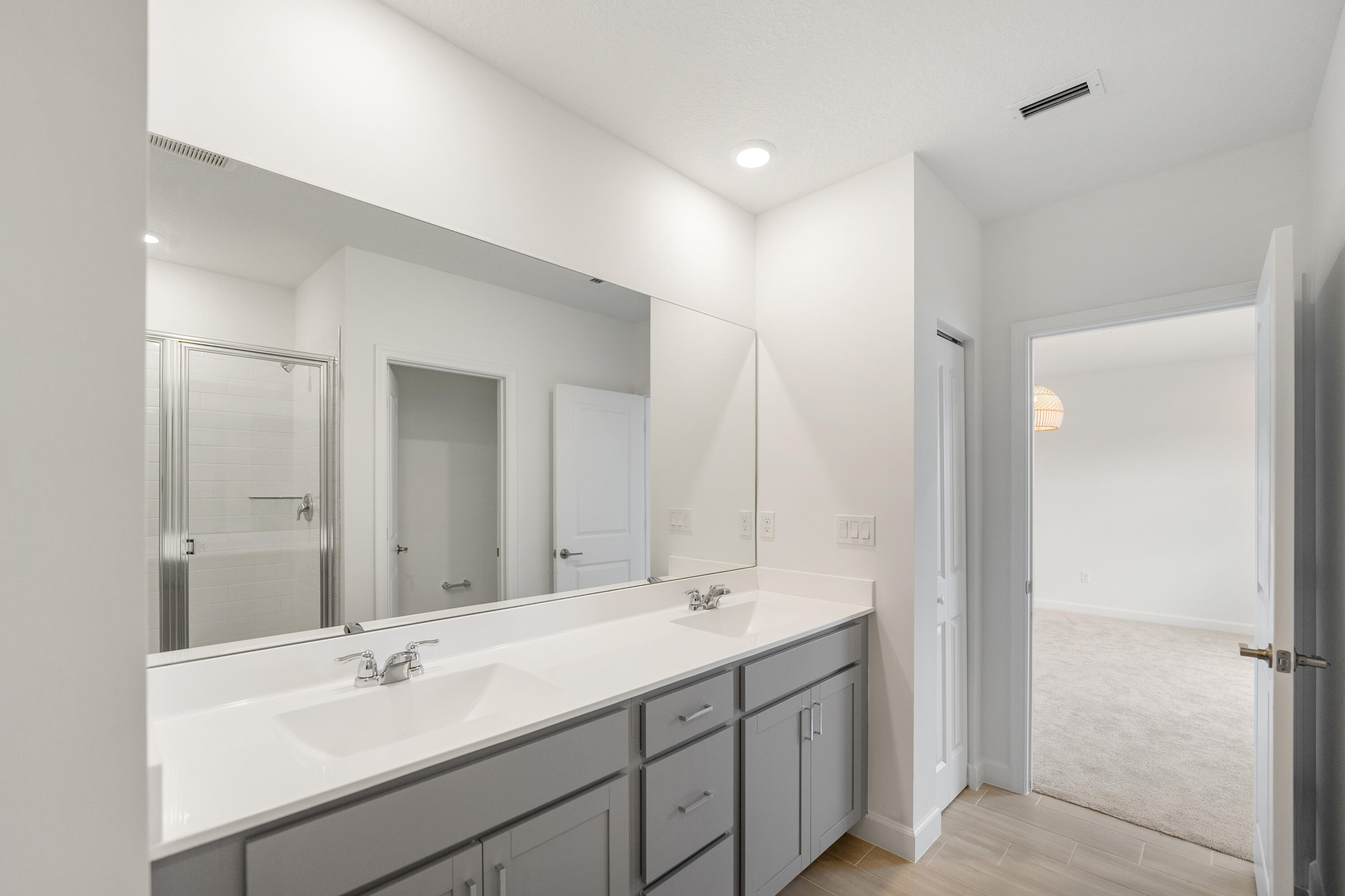 3544 Angler Drive Fort Pierce, FL 34946 - Photo 18 of 39 a bathroom with a sink double vanity and a mirror
