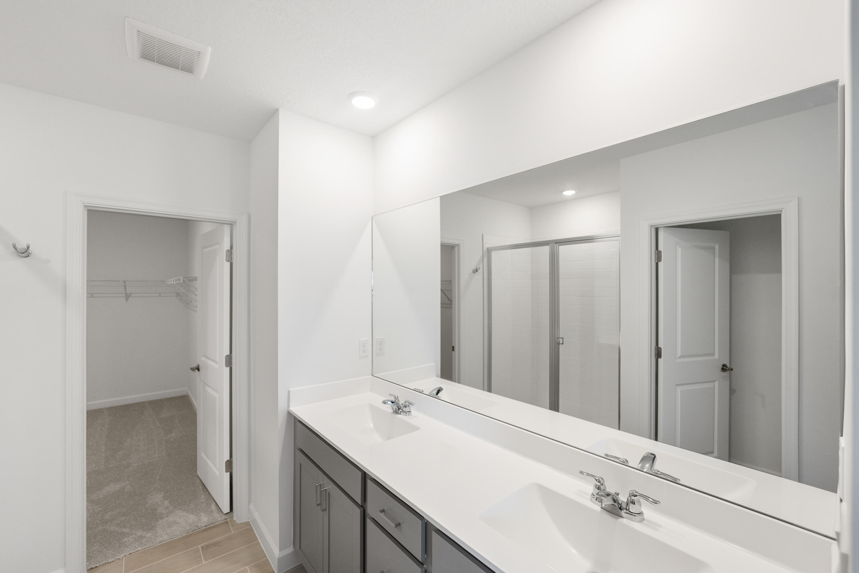 3544 Angler Drive Fort Pierce, FL 34946 - Photo 19 of 39 a bathroom with a double vanity sink mirror and double