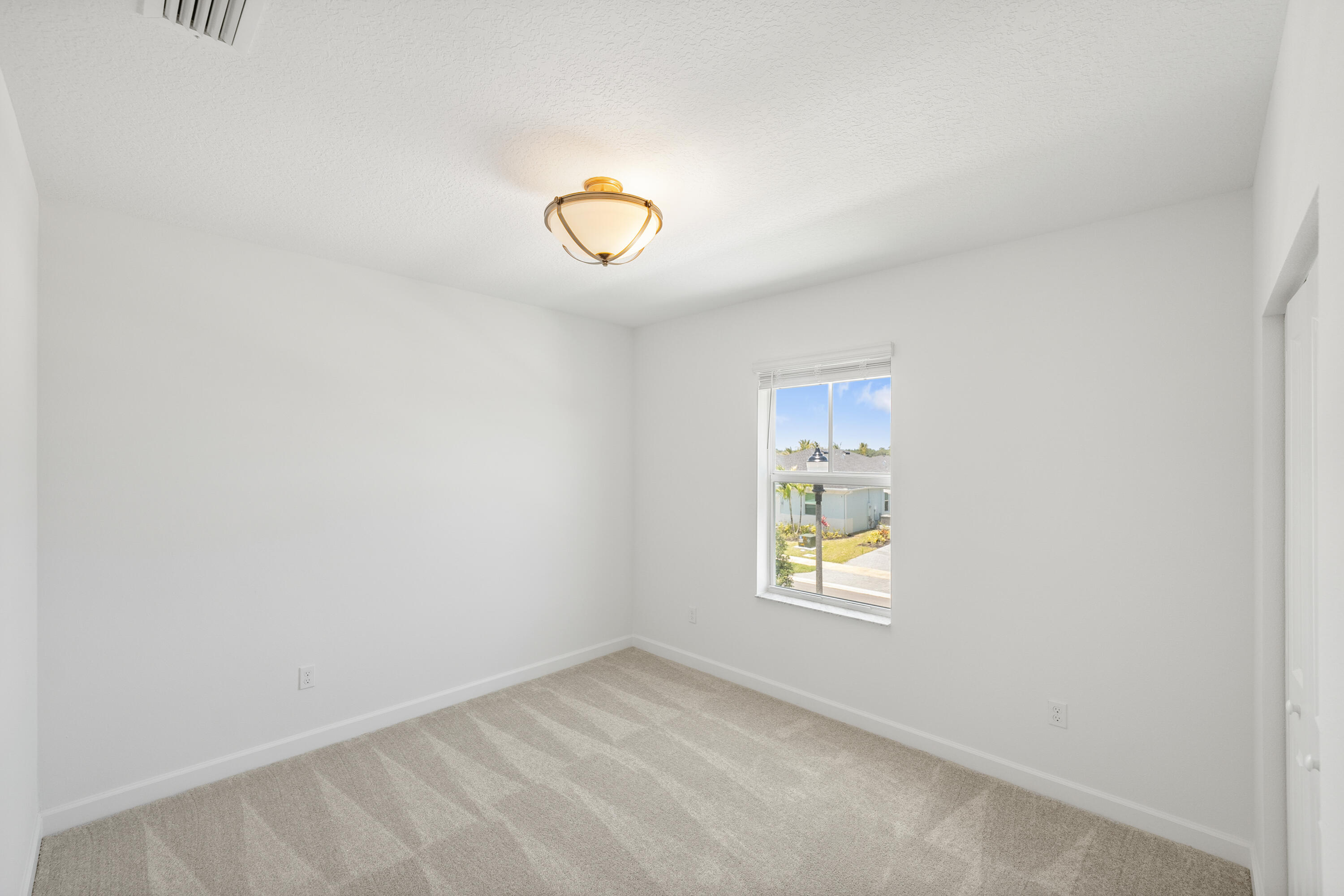 3544 Angler Drive Fort Pierce, FL 34946 - Photo 22 of 39 an empty room with windows
