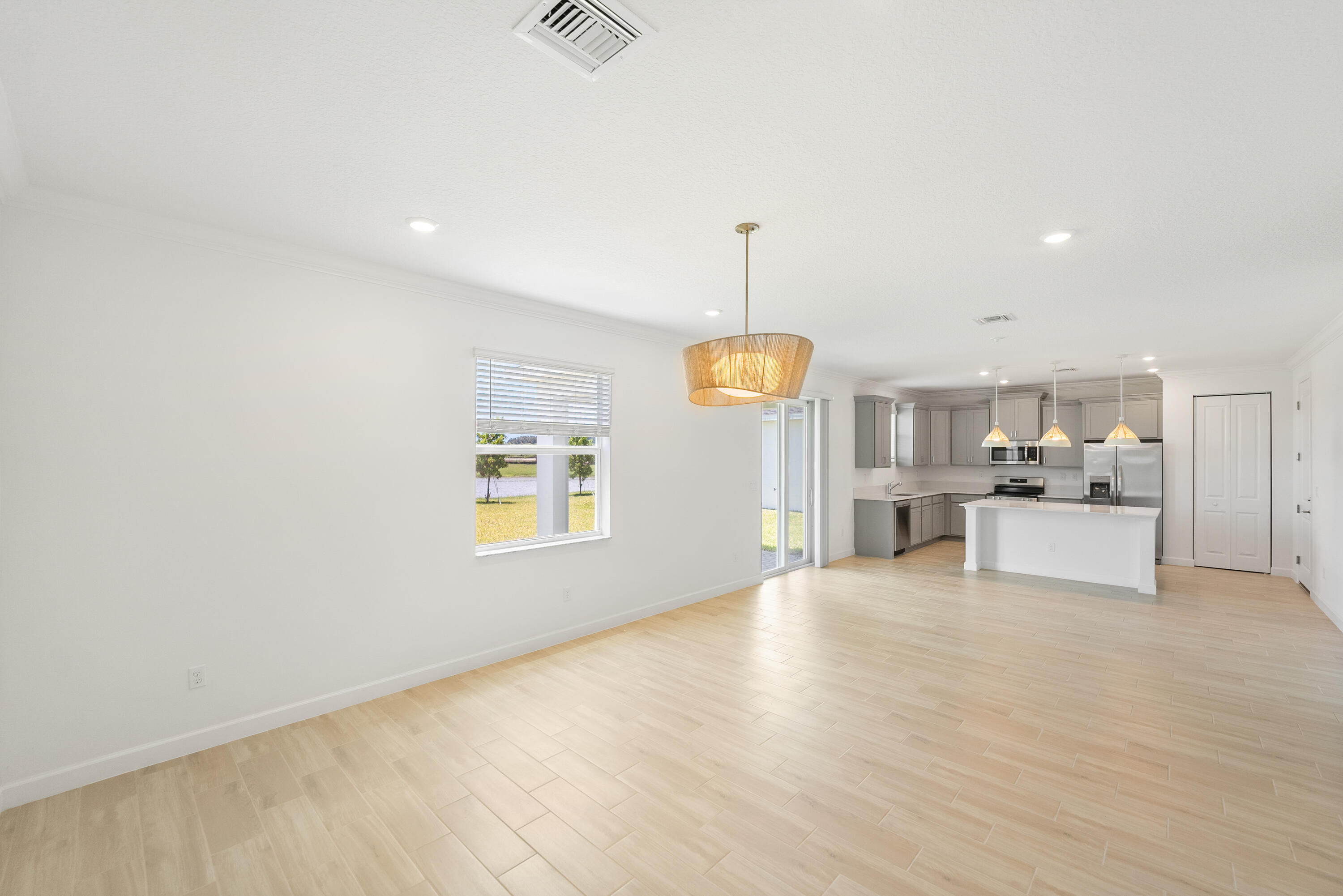 3544 Angler Drive Fort Pierce, FL 34946 - Photo 8 of 39 a view of a livingroom with furniture wooden floor window and fireplace