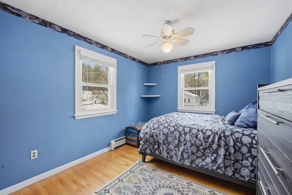 a bedroom with bed and window