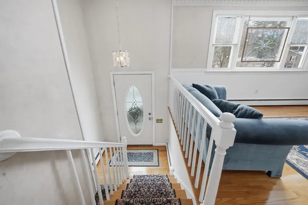 a view of entryway with wooden floor