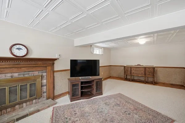 a view of a livingroom with furniture and a flat screen tv