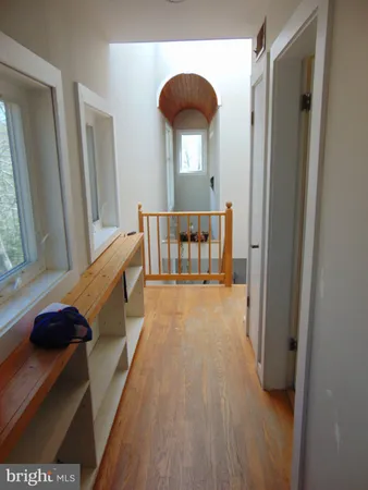 a bed room with a bed and a large window