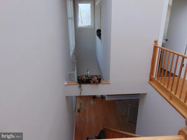 a room that has a bed and a table in it