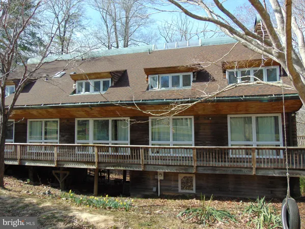 a front view of a house with a large window