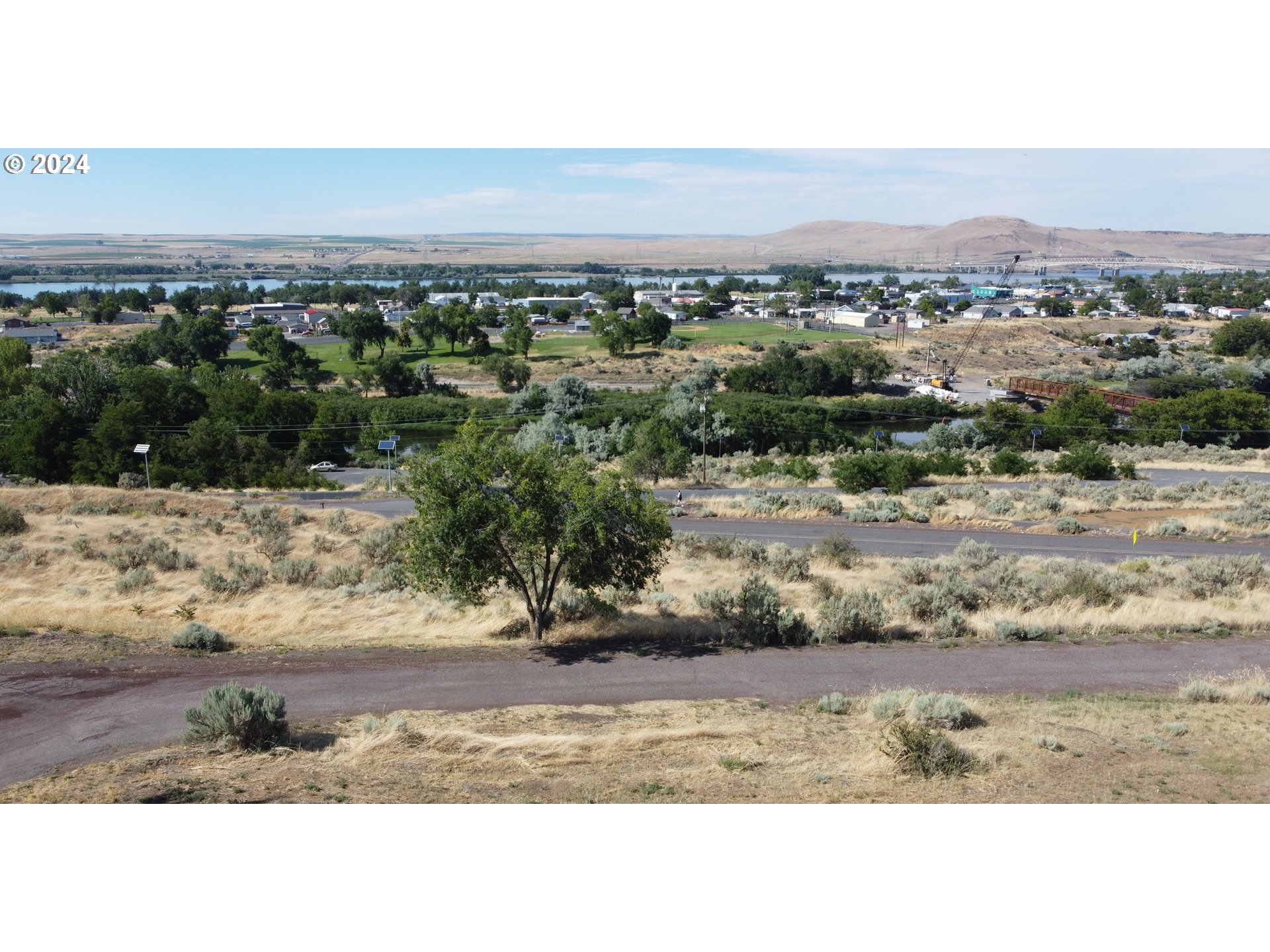 0 Jackson Street Umatilla, OR 97882 - Photo 3 of 4 a view of a dry yard with wooden fence