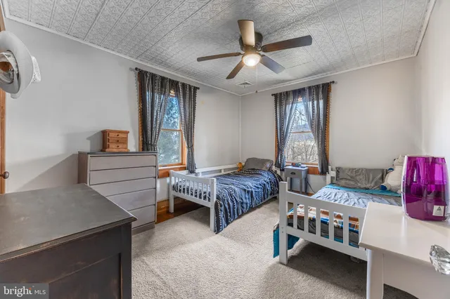 a bedroom with furniture and a chandelier