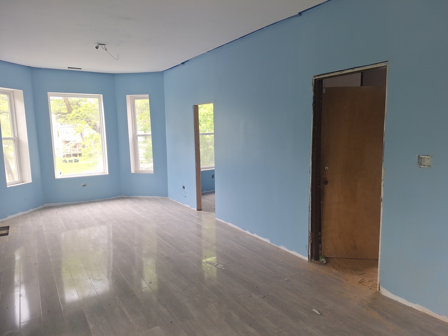 5757 South Carpenter Street Chicago, IL 60621 - Photo 16 of 18 a view of an empty room with windows and closet area