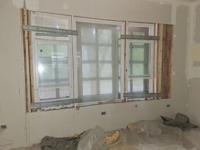 a bathroom with a shower and a sink