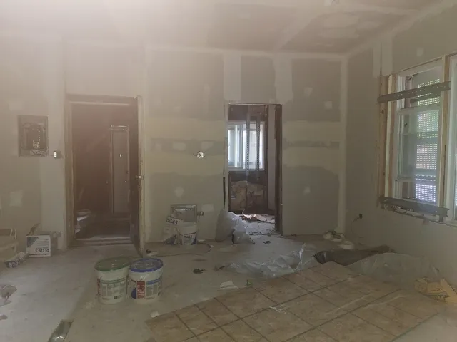 a bathroom with a toilet and shower