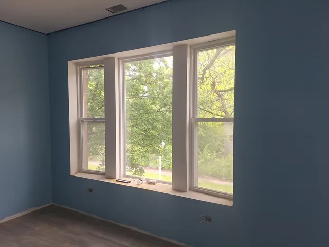 a view of an empty room with a window