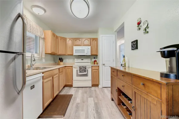 a kitchen with cabinets a sink and a stove